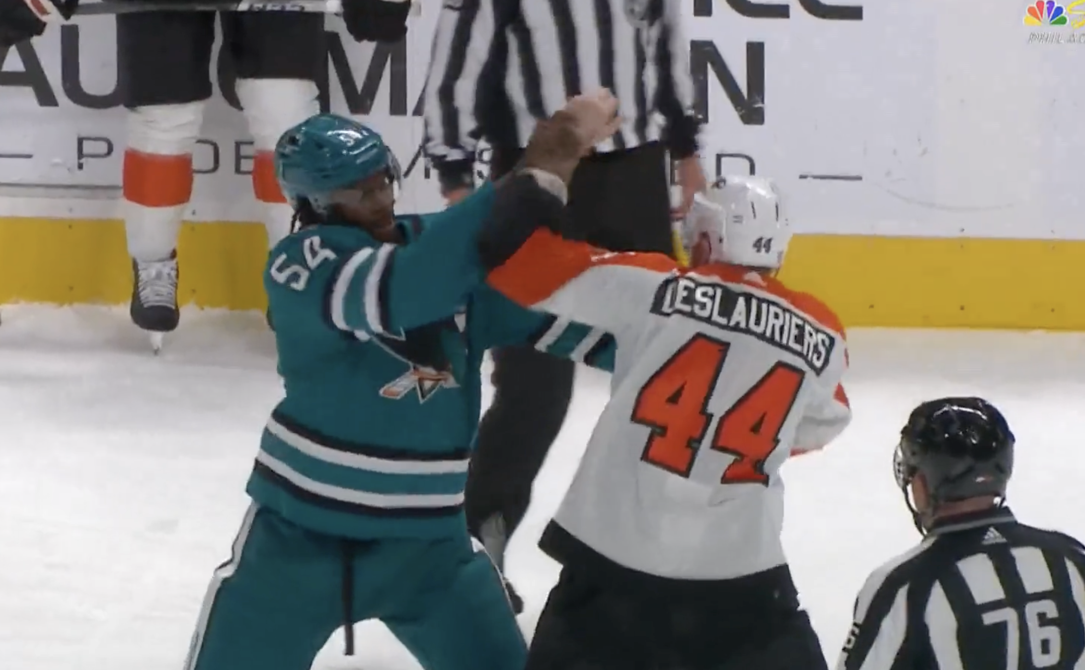 Nicolas Deslauriers of the Philadelphia Flyers fights with Givani Smith of the San Jose Sharks.